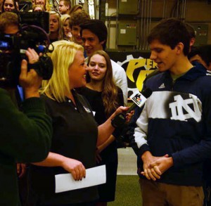 WNDU Reporter Christine Karsten interveiwing a DECA member for Schools Rules