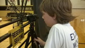 PNN media-camper, Orlando, shoots footage of the Penn basketball camp in the main arena, also known as the Penn Palace.